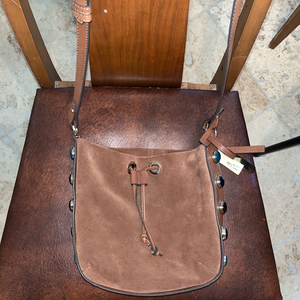 Light brown velvet purse with blue & black details on sides